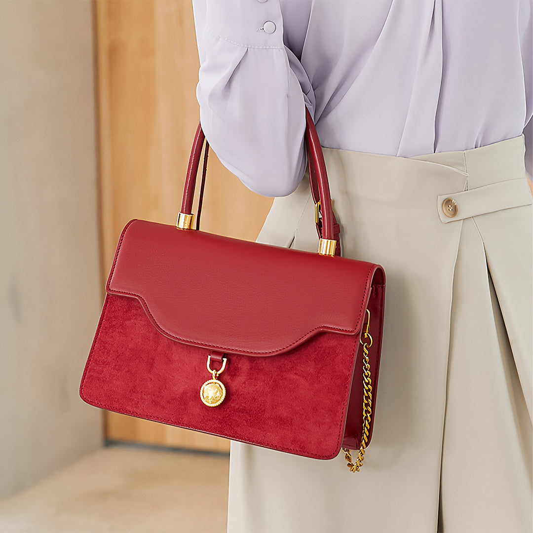 Regal Charm Suede Handbag